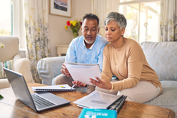 Image showing Laptop, documents and finance with a senior couple in the home living room for retirement or budget planning. Computer, accounting or investment savings with a mature man and woman in a house