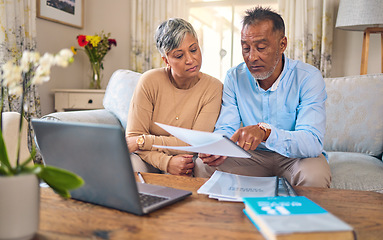 Image showing Laptop, documents and payment with a senior couple in the home living room for retirement or budget planning. Computer, financial or investment savings with a mature man and woman in a house