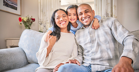 Image showing Portrait, family and smile on sofa in home living room, bonding and having fun. Face, parents and happy child, mother and father with love, relax on couch and enjoying quality time together in house.