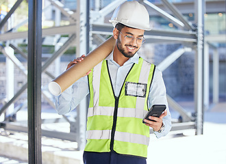 Image showing Architecture, phone typing and happy man with blueprint at construction site, networking and communication with text. Engineering, cellphone and checking email with safety and planning with smile.