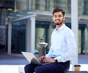 Image showing Portrait, business and man with a laptop, outdoor or typing with connection, digital software or network. Male person, employee or consultant with a pc, city or planning with a smile or data analysis