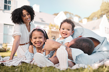 Image showing Love, blended family and parents on the lawn with their children in the garden of their home together. Mother, father and portrait of kids sitting on the grass in the yard of their house for bonding