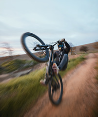 Image showing Cycling, danger and a man in nature with a motorbike for travel, bicycle speed and action on the dirt road. Sport, summer and biker with a motorcycle in the countryside for vacation or power