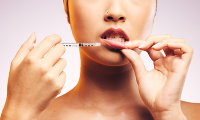 Image showing Beauty, lip filler and hands with botox injection, plastic surgery and portrait of cosmetic dermatology in studio background. Lips of woman, syringe and model with aesthetic facial treatment