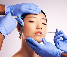 Image showing Skincare, injection and Asian woman with plastic surgery, blue gloves or smooth skin against a white studio background. Japanese, female person or model with needles, cosmetic treatment and face care