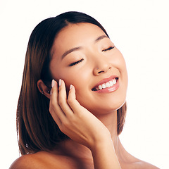 Image showing Skincare, wellness and face of happy Asian woman on a white background for beauty, spa and cosmetics. Dermatology, salon and isolated female person with natural skin, satisfaction or facial in studio