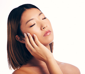 Image showing Skincare, dermatology and face of Asian woman on a white background for wellness, spa and cosmetics. Beauty, salon and isolated female person with natural skin, satisfaction and treatment in studio