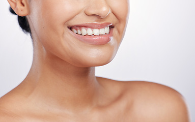 Image showing Closeup, mouth and woman with skincare, dermatology and grooming against a white studio background. Zoom, female person and model with a smile, lips and smooth skin with a glow, shine and dental care