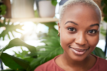 Image showing Portrait, plant and flare with a black woman gardener in her home for sustainability or green growth. Face, beauty and smile with a happy young female person in a nursery for eco conscious gardening