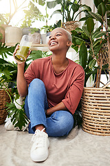 Image showing Healthy, black woman and green juice for nutrition or wellness with smile for diet in home with plant. Vegetarian, smile and girl with detox smoothie or shake for weightloss with fruit or vegetable.