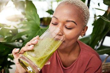 Image showing Black woman, diet and smoothie drink for vitamins, fiber or health and wellness in eco friendly store. Face of African female person drinking healthy beverage or organic fruit juice to lose weight
