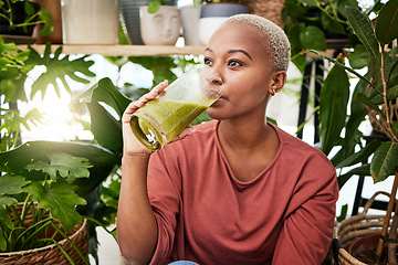 Image showing Healthy, black woman and drinking a green smoothie for nutrition with vegetables for supplement. Girl, detox and enjoying a vegan drink for home or weightloss with vitamin or plants and fruit shake.