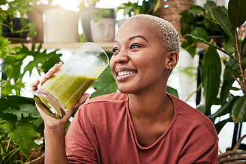 Image showing Black woman, healthy and green smoothie with nutrition for detox or smile with wellness in home. Vegan, drink and girl for natural beverage or smoothie for diet with healthy fruits or plant for juice
