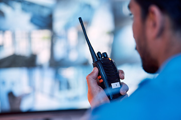 Image showing Security guard, radio and cctv monitor, communication and inspection service for building safety. Screen, video surveillance agency and law officer in control room talking on two way intercom system.