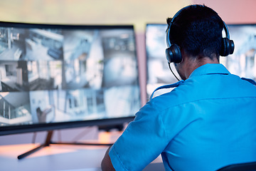 Image showing Security guard, headphones and cctv monitor, communication and inspection service for building safety. Screen, video surveillance agency and law officer in control room listening and checking system.