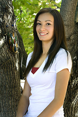 Image showing Beautiful Teenager with Leaves in the Background