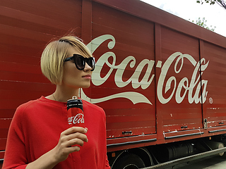 Image showing Kyiv, Ukraine - July 6, 2017 Beautiful fashionable woman with model release drinking Coca-Cola soda