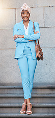 Image showing Crossed arms, smile and portrait of businesswoman on stairs in the city by her office building. Happy, briefcase and full body of professional African female lawyer with confidence in an urban town.