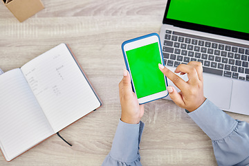 Image showing Technology, hands of woman with smartphone and green screen on laptop with notebook for research. Planning or mockup space, online communication or internet and top view of female person at office