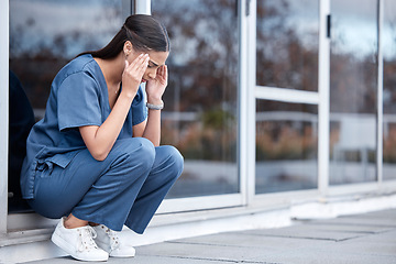 Image showing Anxiety, doctor or a woman with a headache from healthcare, surgery mistake or death at a hospital. Sad, depressed and a tired female nurse with a migraine or burnout from medical career at a clinic