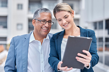 Image showing Tablet, collaboration and a business team working together while doing research for an online project. Technology, planning and a corporate woman with her senior mentor, manager or boss in the city