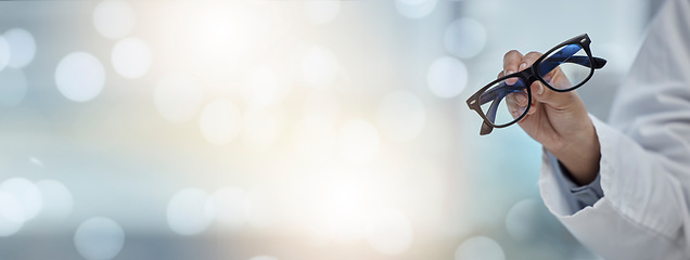 Image showing Mockup banner, glasses and hand of an optometrist for vision, healthcare and eye care product. Space, bokeh and a doctor or optician with eyewear recommendation or showing for medical optometry