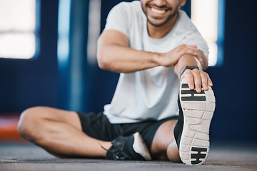 Image showing Foot, exercise and stretching with a sports man in the gym getting ready for a cardio training routine. Fitness, health and warm up with a male athlete in preparation of a workout for wellness