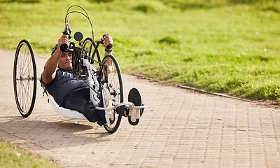 Image showing Sports, fitness and man with disability on bike, training for competition with motivation and cycling exercise. Path, cycle workout and person on recumbent bicycle for outdoor race track challenge.