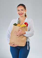 Image showing Portrait, smile and woman with grocery bag, fruit and sales in studio isolated on a white background. Shopping, food and happy customer with organic vegetables for nutrition, healthy diet or wellness