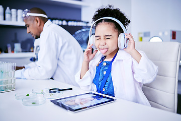 Image showing Crazy, lab and child with music and tablet for science with a father or scientist for work or learning. Funny, future and a comic girl streaming audio on tech with a person for innovation in medicine