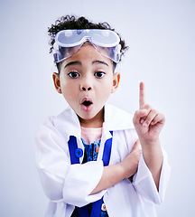 Image showing Child, hand and idea or solution for science in studio with mouth open, glasses and thought. Face of a African kid student shocked or wow for scientist, education or biology experiment for innovation