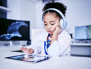 Image showing Education, headphones and black girl with elearning on tablet with childhood development. Studying, typing and tech with female child with reading for lessons with online app and software with kid.