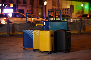 Image showing Luggage consisting of six polycarbonate suitcases standing on the street