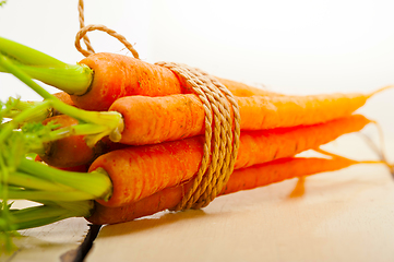 Image showing baby carrots bunch tied with rope