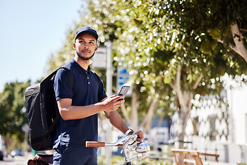 Image showing Bicycle, phone and delivery service by man use maps on smartphone to navigate city for package, product or fast food. Bike, mobile app and courier employee use internet for direction or ecommerce web