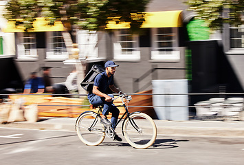 Image showing Transportation, delivery on bicycle with package and city street for logistics. Eco friendly transport or distribution service, bike courier and male person with parcel for customer service in road