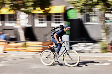 Image showing Delivery, man or motion blur on bike in city for quick logistics, service or fast food order. Courier, postman or travel for speed on bicycle transportation with parcel, package or trip in urban road