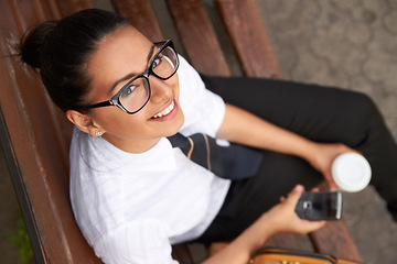 Image showing School, portrait from above and student with a phone after class, education or rest from studying and learning. Girl, smile on face and reading or drinking tea on coffee break formal uniform