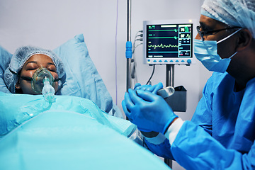 Image showing Healthcare, doctor and patient holding hands in hope after surgery, emergency care and hospital bed. Breathing, monitor and air, surgeon with helping hand in operation, support for medical results.
