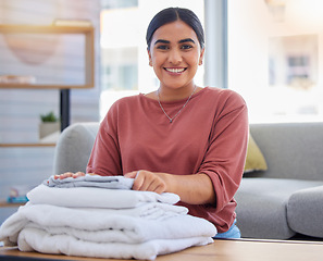 Image showing Cleaning, happy and laundry with portrait of woman in living room for housekeeping service, clothes and fabric. Hospitality, smile and cleaner with person at home for maintenance and washing