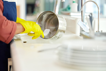 Image showing Hands of woman, gloves and washing dishes in kitchen, brush chores and house work, cleaner service and home care. Cleaning, soap and water, housekeeper working in apartment with dirt and foam at sink