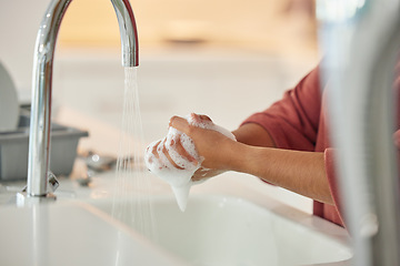 Image showing Washing hands, cleaning and person with hygiene and water for wellness in a kitchen faucet. Soap foam, sink and home with bacteria prevention and safety with disinfection with liquid before cooking