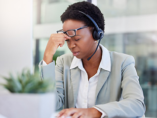 Image showing Call center, headache and black woman frustrated by faq, customer service or internet delay in office. Stress, migraine and African lady consultant with vertigo, glitch or problem while consulting