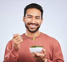 Image showing Fruit, portrait and happy asian man in studio for health, wellness and detox on grey background. Breakfast, salad and face of guy nutritionist smile for healthy, clean or raw diet for vegan lifestyle