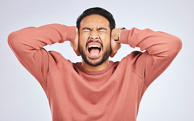 Image showing Shouting, anxiety and hands on ears of asian man in studio with headache, brain fog or frustrated on grey background. Noise, stress and angry guy person scream for tinnitus, depression or vertigo