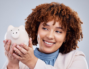 Image showing Woman with smile, piggy bank and savings in studio, finance and budget in hands with investment loan. Happiness, growth and profit inflation, salary management girl with money box on white background