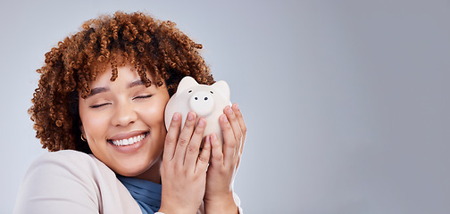 Image showing Happy woman with mockup, piggy bank and savings in studio, finance and budget in hands for investment plan. Happiness, growth and profit, salary management for girl with money box on white background