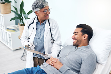 Image showing Man, doctor and insurance report with talk and senior professional at a hospital for health. Wellness, consultation and patient at a medical clinic for expert advice and woman with healthcare