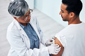 Image showing Doctor, arm and man with plaster for vaccine, healthcare protection and safety from virus in clinic. Consultation, patient and woman medical professional in hospital for vaccination or medicine cover