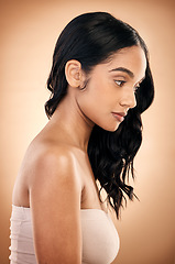Image showing Thinking, texture and woman with hair care, salon treatment and self care against a brown studio background. Female person, girl and model with ideas, aesthetic and skincare with beauty and luxury